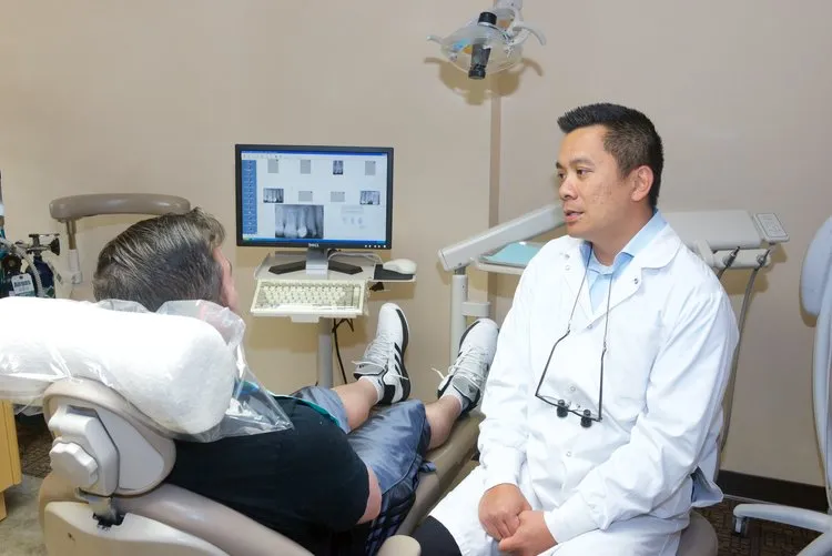 Dr. Raymond Liu with patient