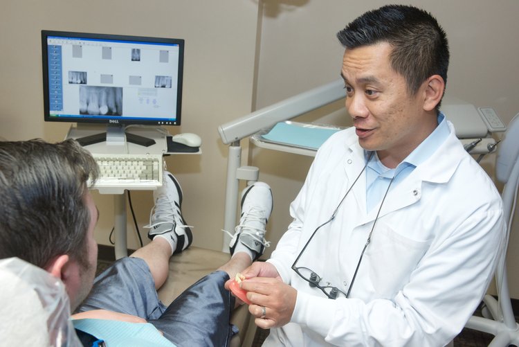 Dr. Raymond Liu with patient